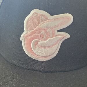 MLB Orioles New Era Black Cap with Pink Logo